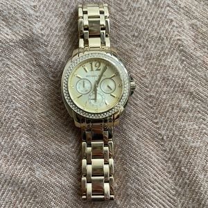 Michael Kors gold watch.